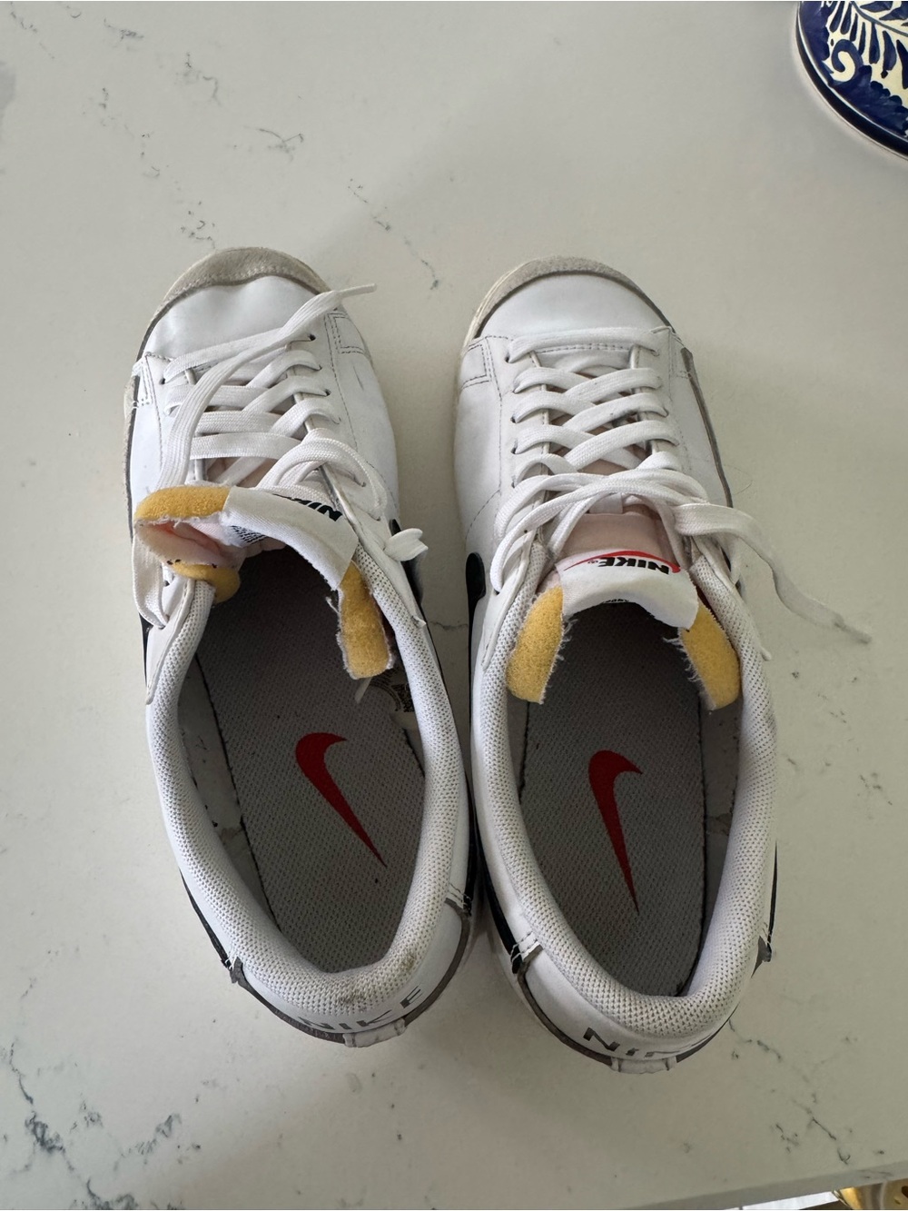 Nike White Low-Top Sneakers with Red Swoosh